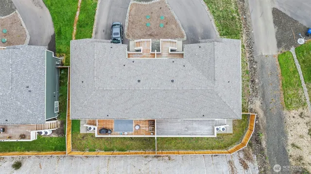 an aerial view of a house with a swimming pool