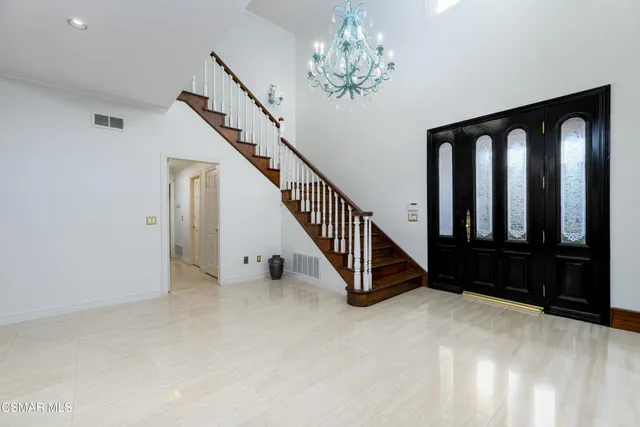 a view of a livingroom with furniture window and wooden floor