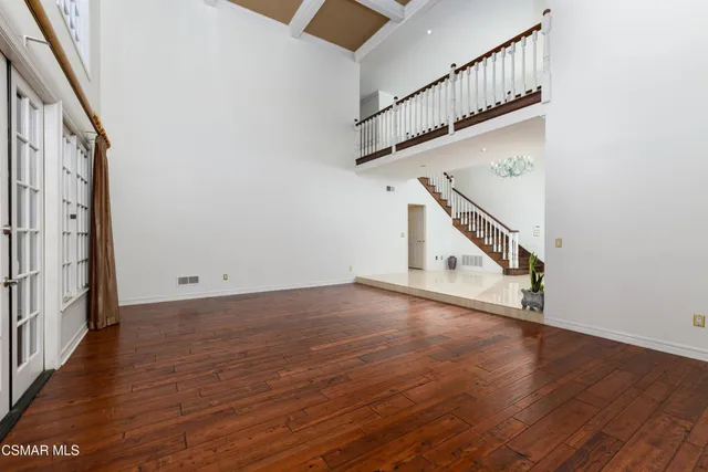 a kitchen with kitchen island granite countertop a stove and a sink