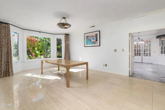 a kitchen with stainless steel appliances white cabinets a stove and a microwave