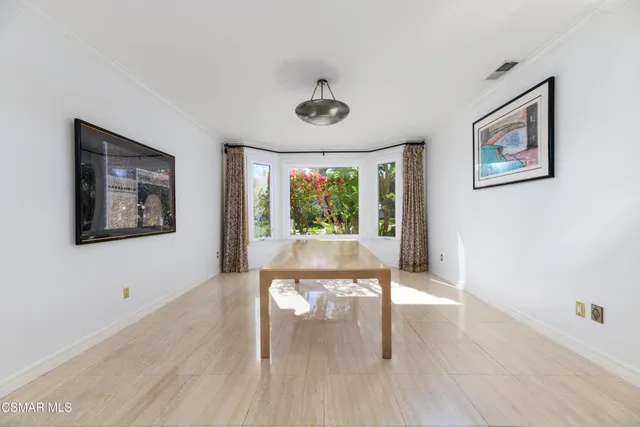 a kitchen with granite countertop cabinets stainless steel appliances and a window
