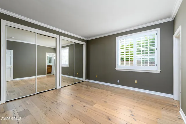 a bathroom with a granite countertop sink and a toilet