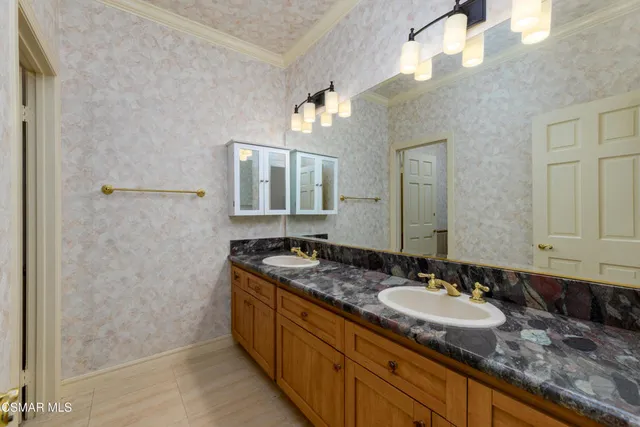 a white toilet sitting next to a bathroom sink