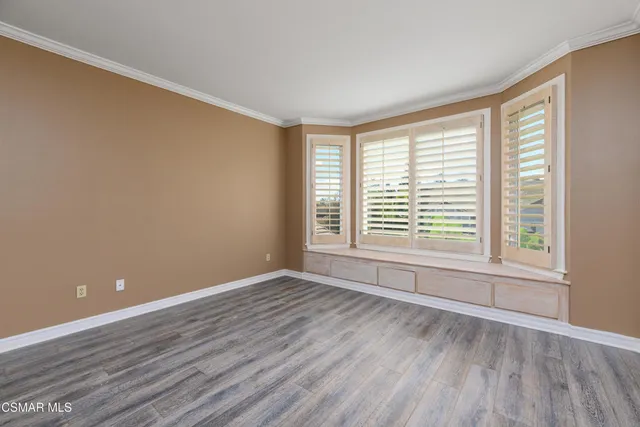 an aerial view of a house with garden space and street view