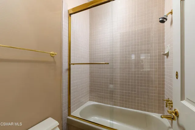 a picture of a bathroom with mirror