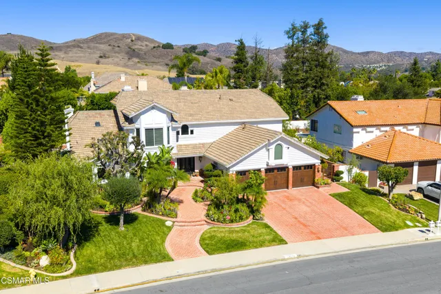 an aerial view of a house with swimming pool yard and outdoor seating