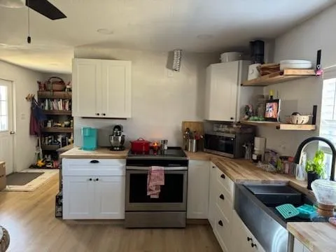 a kitchen with cabinets and appliances