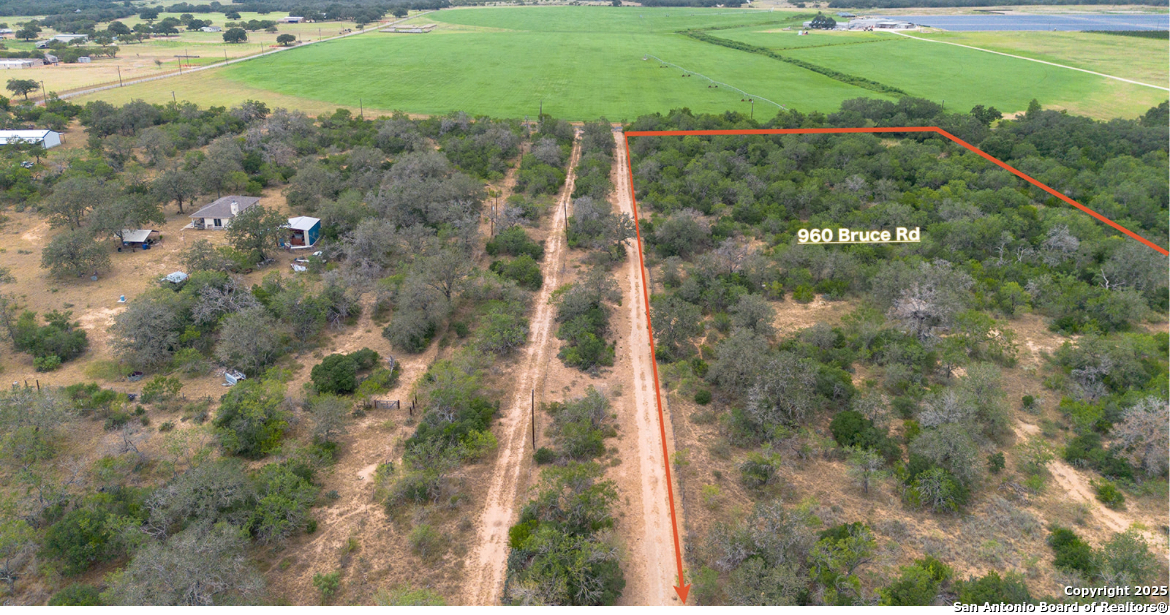 960 Bruce Road Poteet, TX 78065 - Photo 2 of 7 a view of a yard