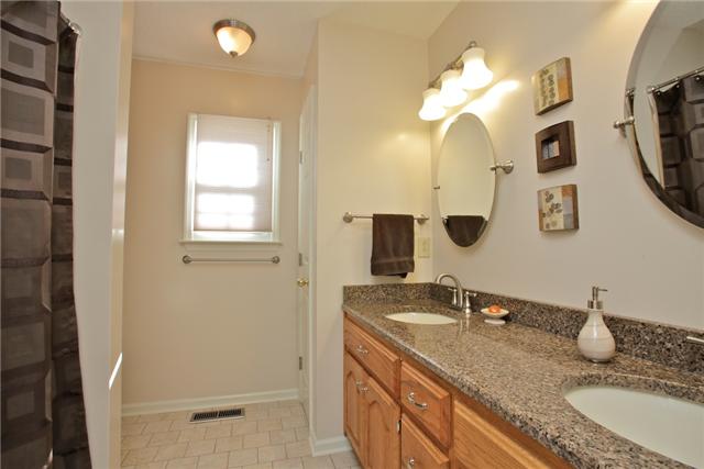 617 Blue Ridge Drive Columbia, TN 38401 - Photo 13 of 19 Master Bath has tile flooring, granite countertop and linen closet.