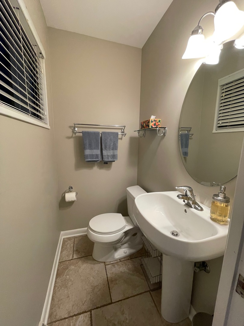 539.5 Ridge Road Wilmette, IL 60091 - Photo 8 of 11 a bathroom with a sink toilet and a mirror