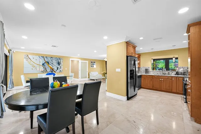 a kitchen with stainless steel appliances granite countertop a stove and a microwave