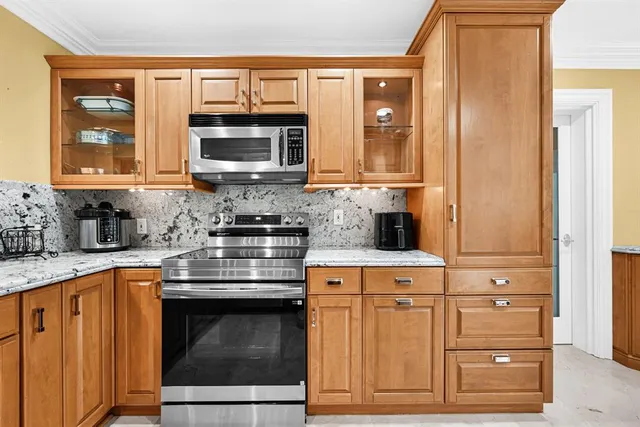 a bedroom with furniture and a large window