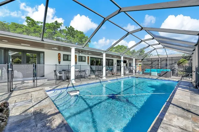 a view of kitchen with dining area and windows