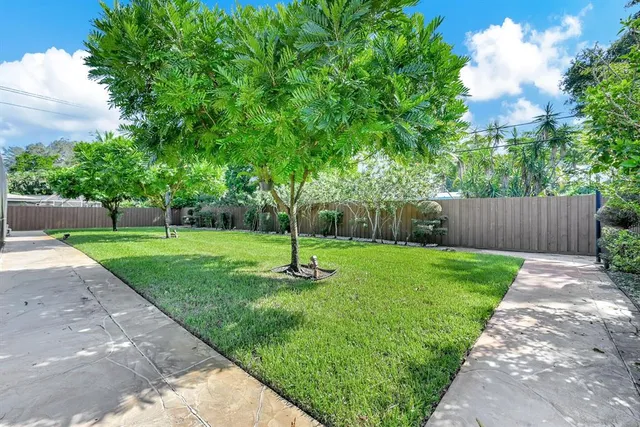 a living room with a fireplace and a table