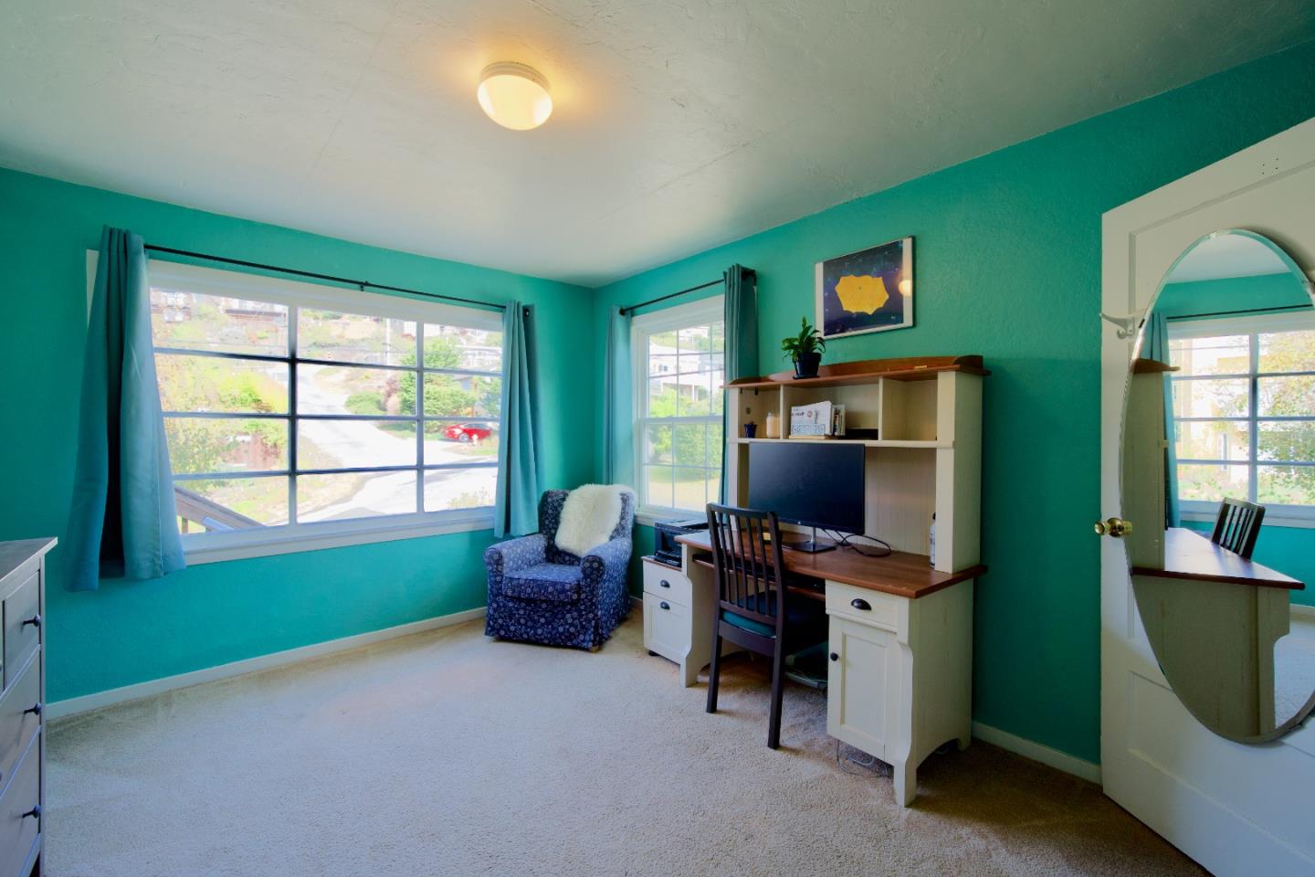 390 Pacific Avenue Pacifica, CA 94044 - Photo 12 of 24 a living room with furniture and a flat screen tv