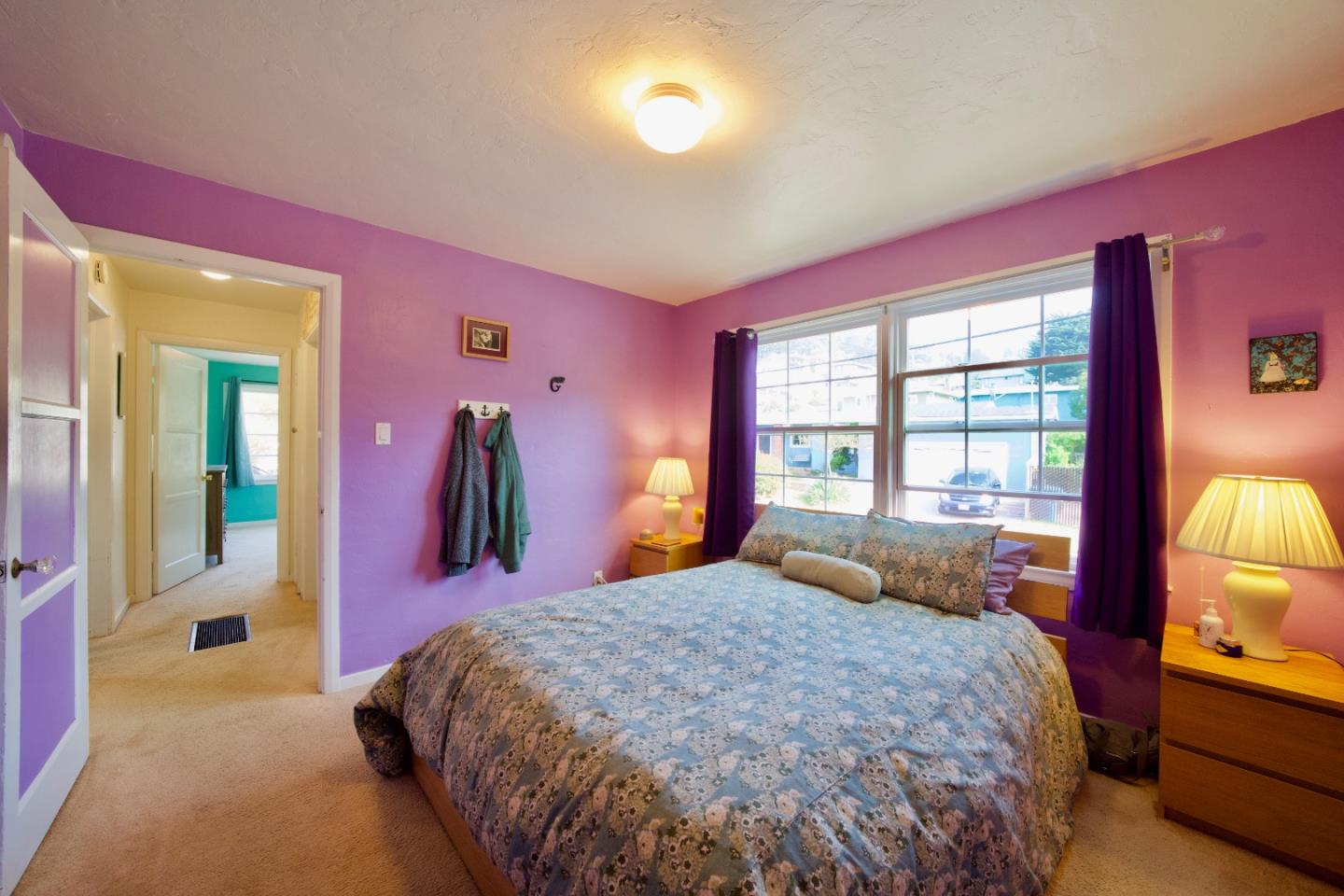 390 Pacific Avenue Pacifica, CA 94044 - Photo 15 of 24 a bed room with a bed mirror and a window