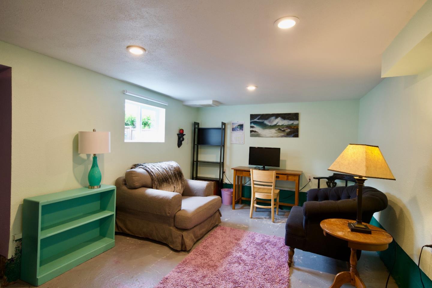390 Pacific Avenue Pacifica, CA 94044 - Photo 19 of 24 a living room with furniture and a wooden floor