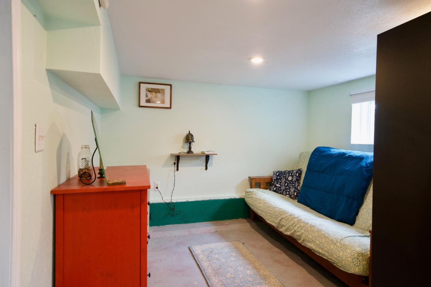 390 Pacific Avenue Pacifica, CA 94044 - Photo 20 of 24 a living room with furniture and a flat screen tv