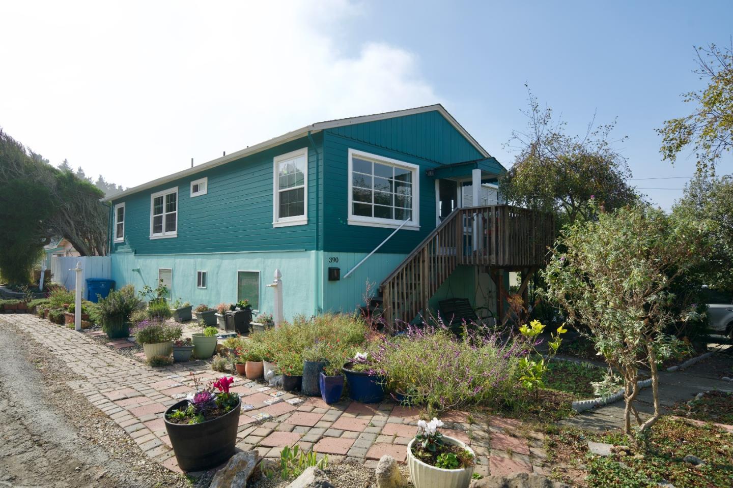 390 Pacific Avenue Pacifica, CA 94044 - Photo 2 of 24 a front view of a house with a yard