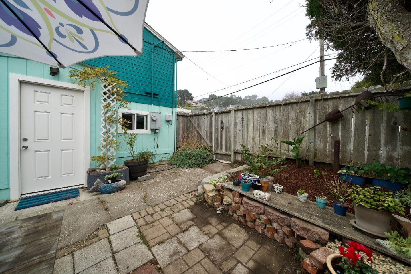 390 Pacific Avenue Pacifica, CA 94044 - Photo 21 of 24 a backyard of a house with lots of green space