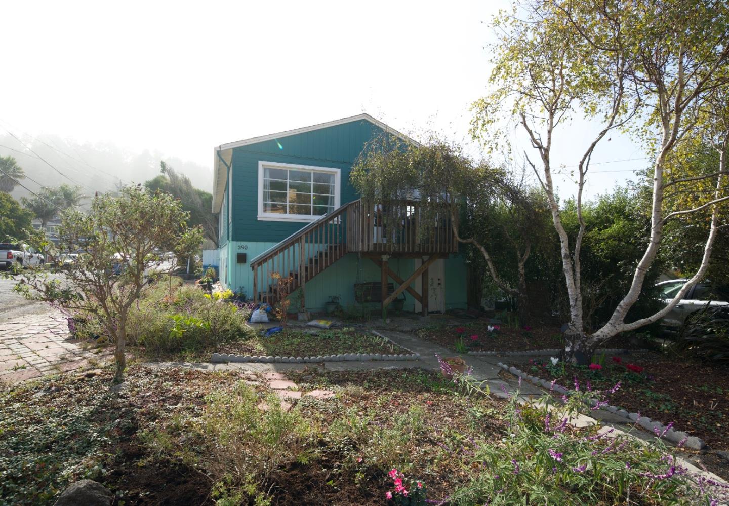 390 Pacific Avenue Pacifica, CA 94044 - Photo 3 of 24 a view of a house with a yard
