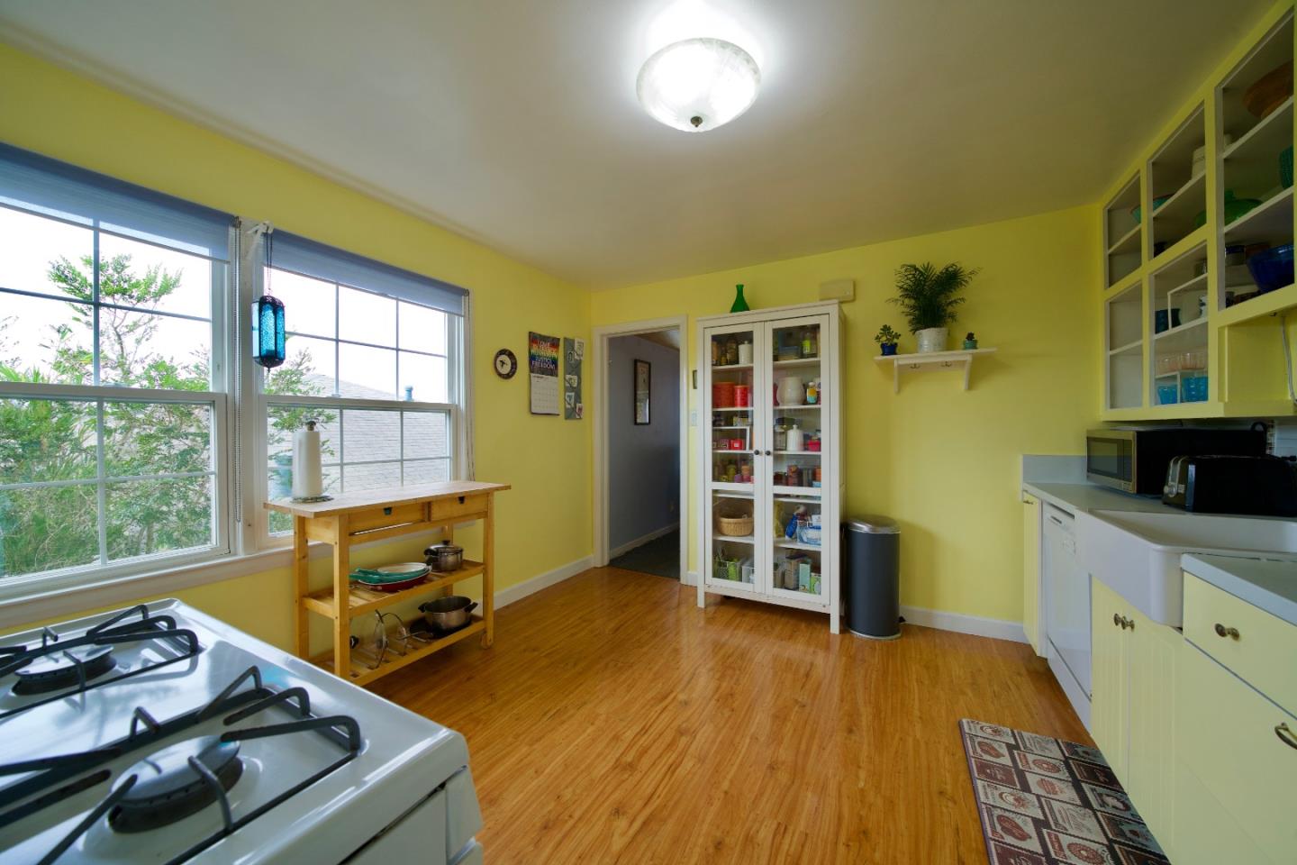 390 Pacific Avenue Pacifica, CA 94044 - Photo 9 of 24 a living room with furniture and a wooden floor