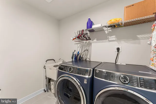 a view of storage and utility room with washer and dryer