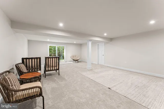 a spacious bedroom with a bed and a large window