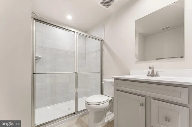 a view of a chair and table on the deck