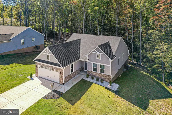 a aerial view of a house with a yard