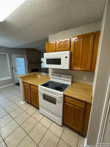 a kitchen with a stove and a microwave