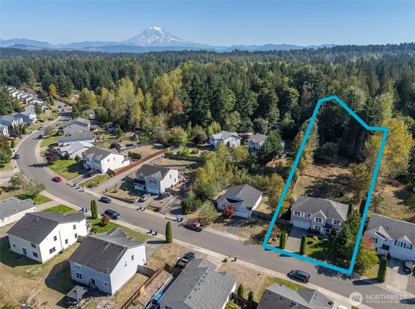 an aerial view of a city with lots of residential buildings