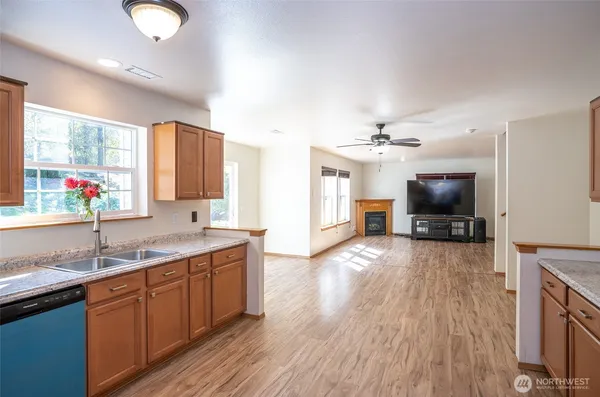 a kitchen with a sink and a stove top oven