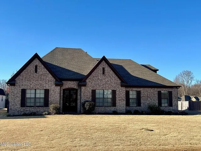 a front view of a house with yard