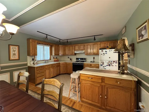 a kitchen with sink cabinets and window