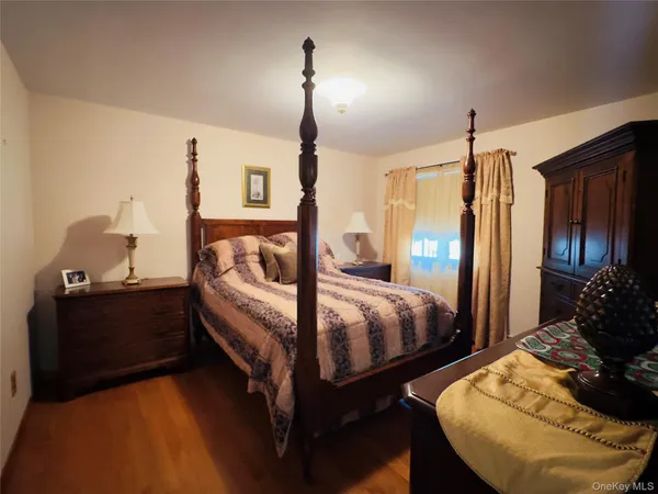 a bed room with bed and a window