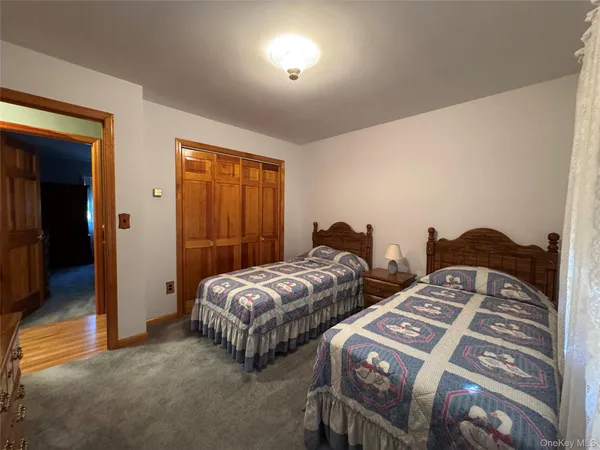 a bedroom with two beds and painted walls