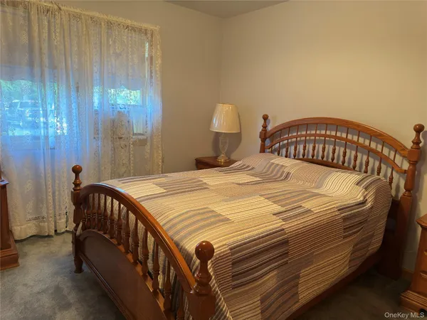 a bedroom with a bed and a table