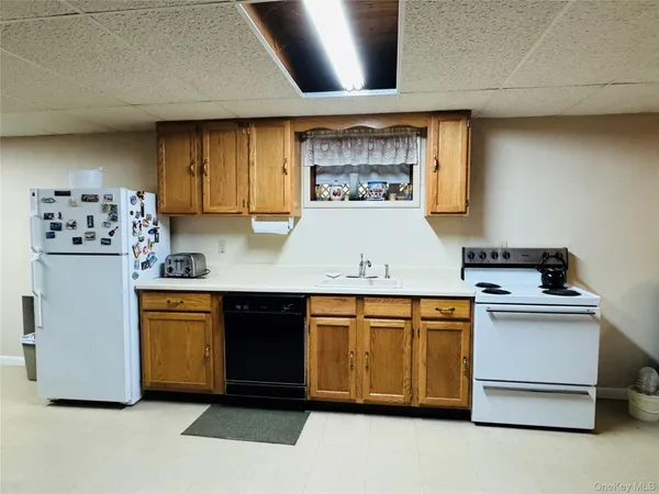a kitchen with stainless steel appliances granite countertop a stove and a refrigerator