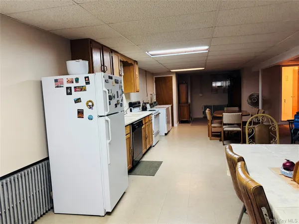 a view of kitchen with furniture and wooden floor