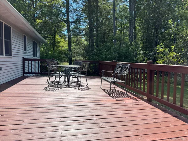 a view of roof deck with patio