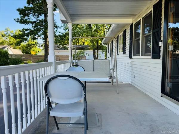 a view of a two chairs in the roof deck
