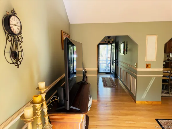 a view of a entryway door with wooden floor
