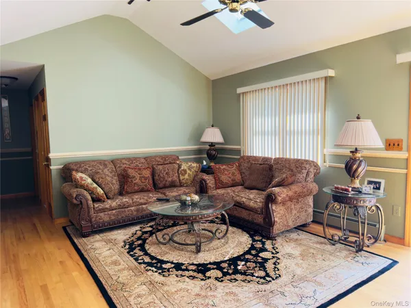 a living room with furniture and a rug