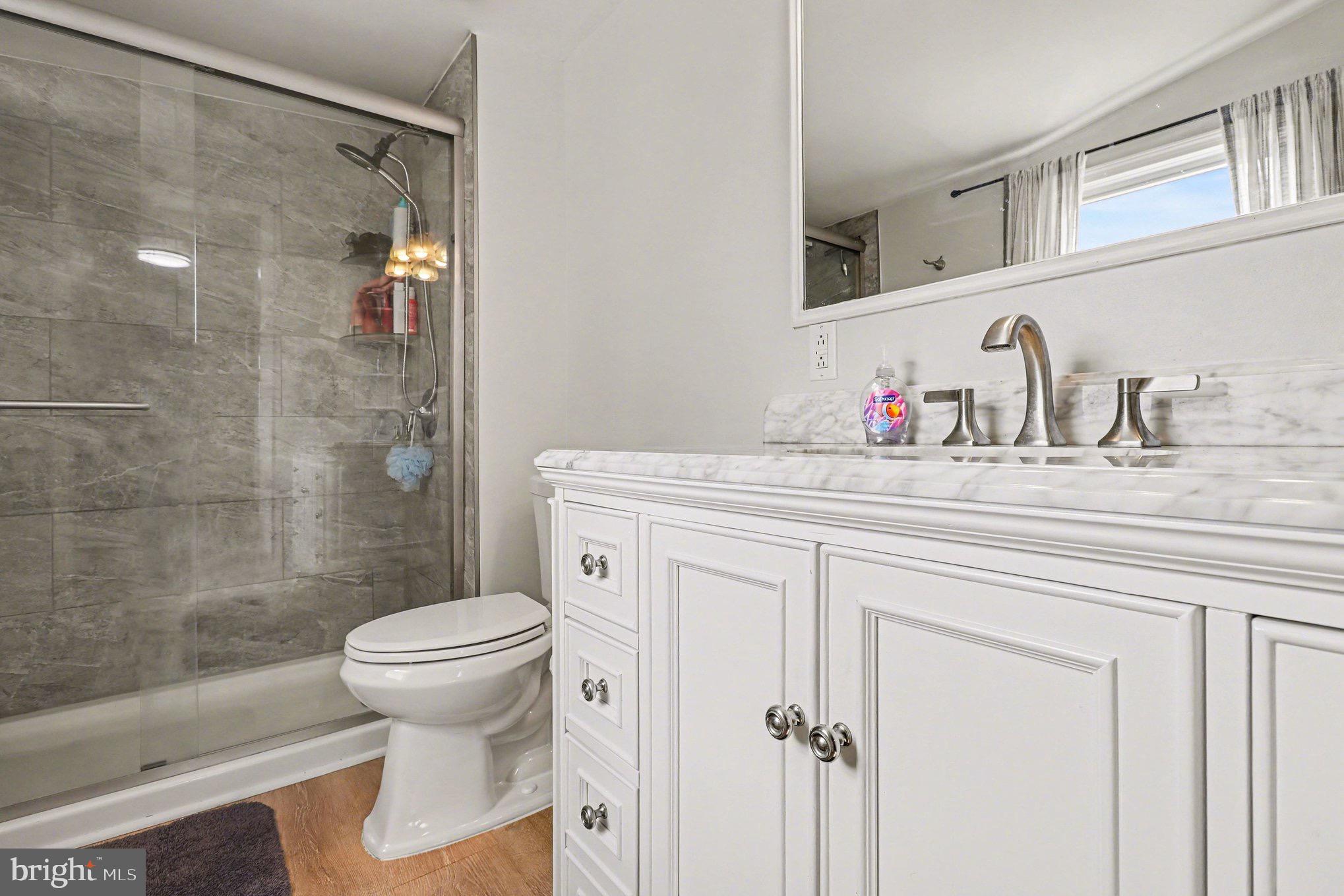 5408 Lewiston Road Spotsylvania, VA 22551 - Photo 12 of 32 a bathroom with a sink toilet and shower
