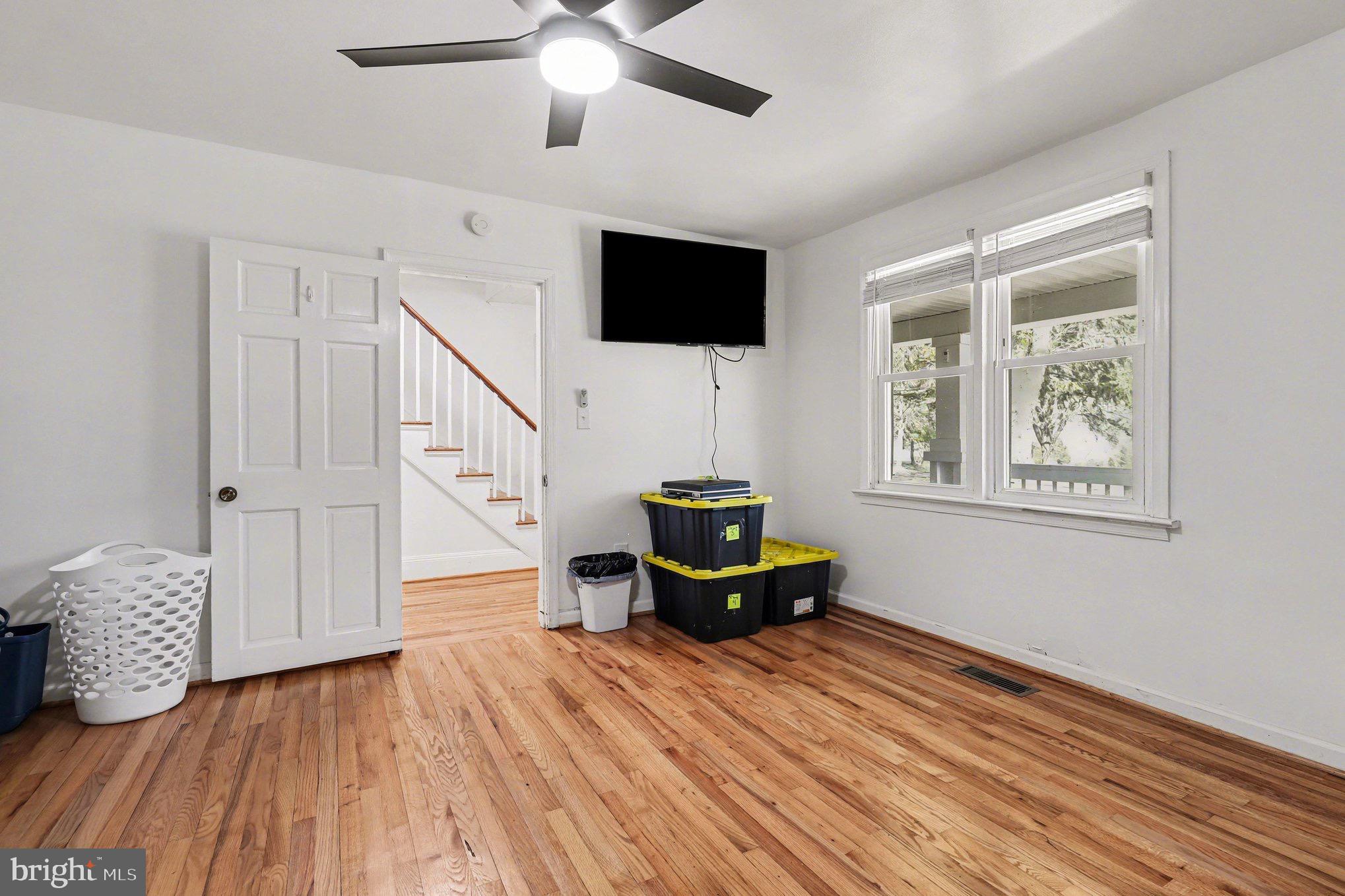 5408 Lewiston Road Spotsylvania, VA 22551 - Photo 15 of 32 a living room with furniture and a flat screen tv
