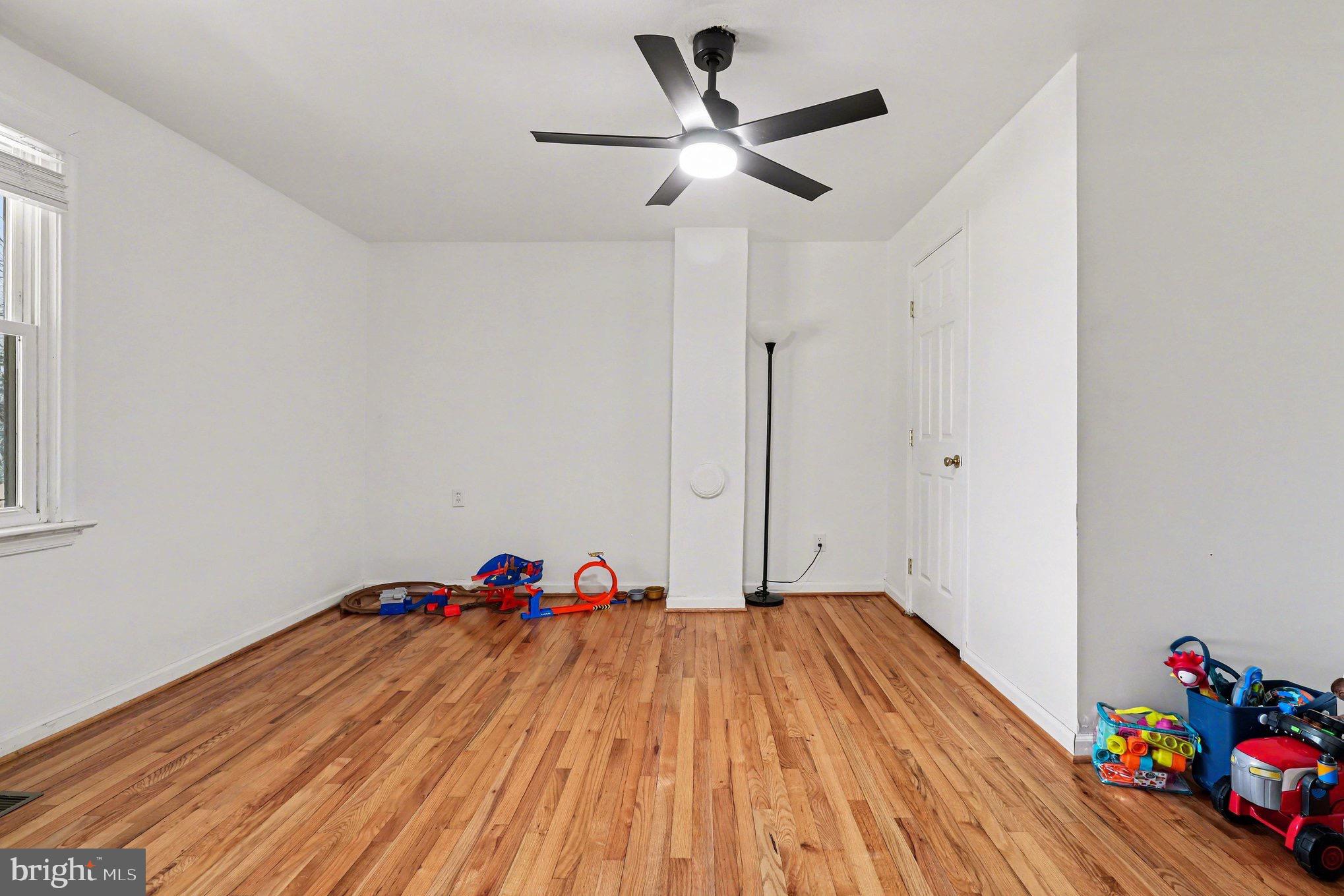 5408 Lewiston Road Spotsylvania, VA 22551 - Photo 16 of 32 a bed room with a bed and a chandelier