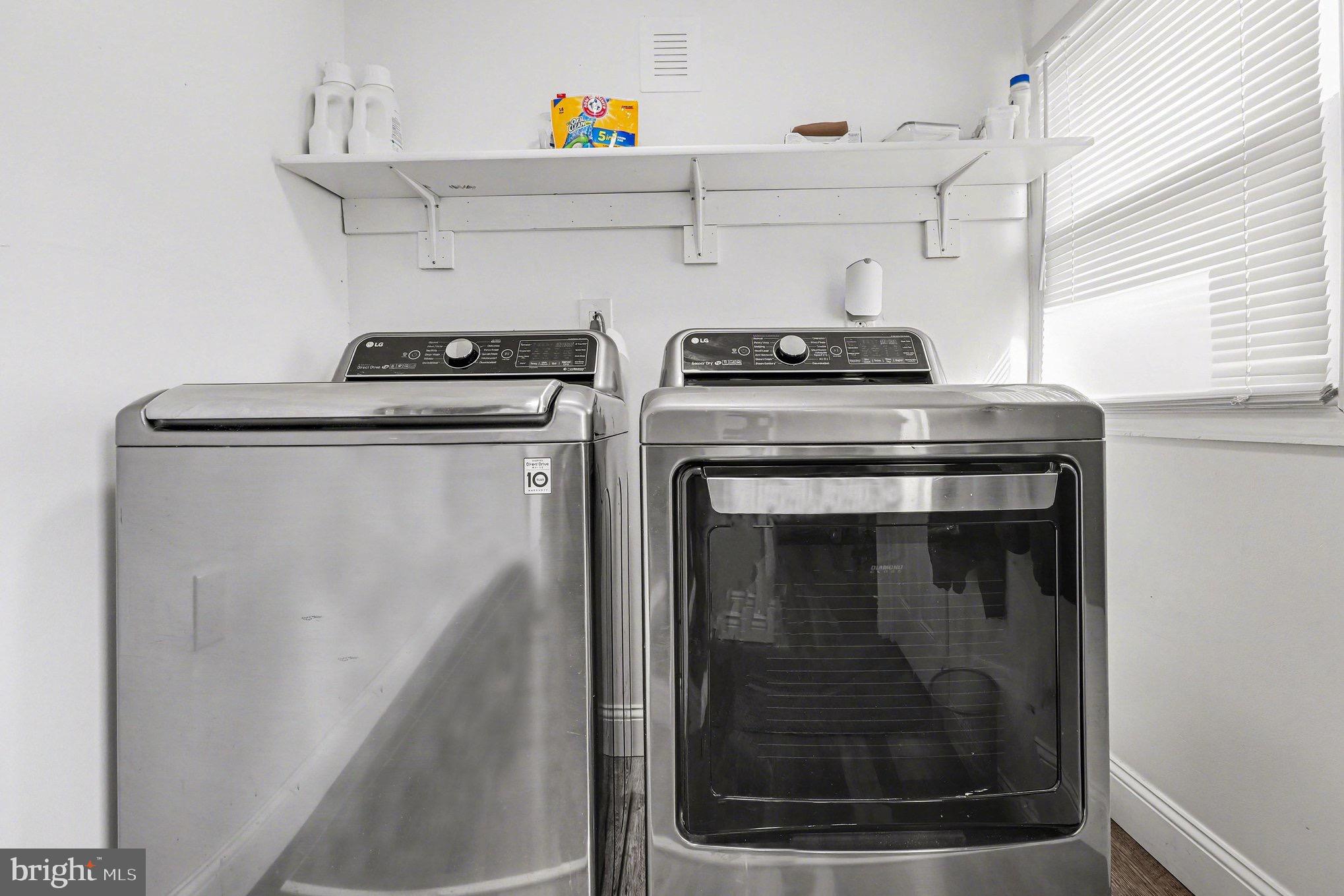 5408 Lewiston Road Spotsylvania, VA 22551 - Photo 17 of 32 a view of washer and dryer with kitchen in the background