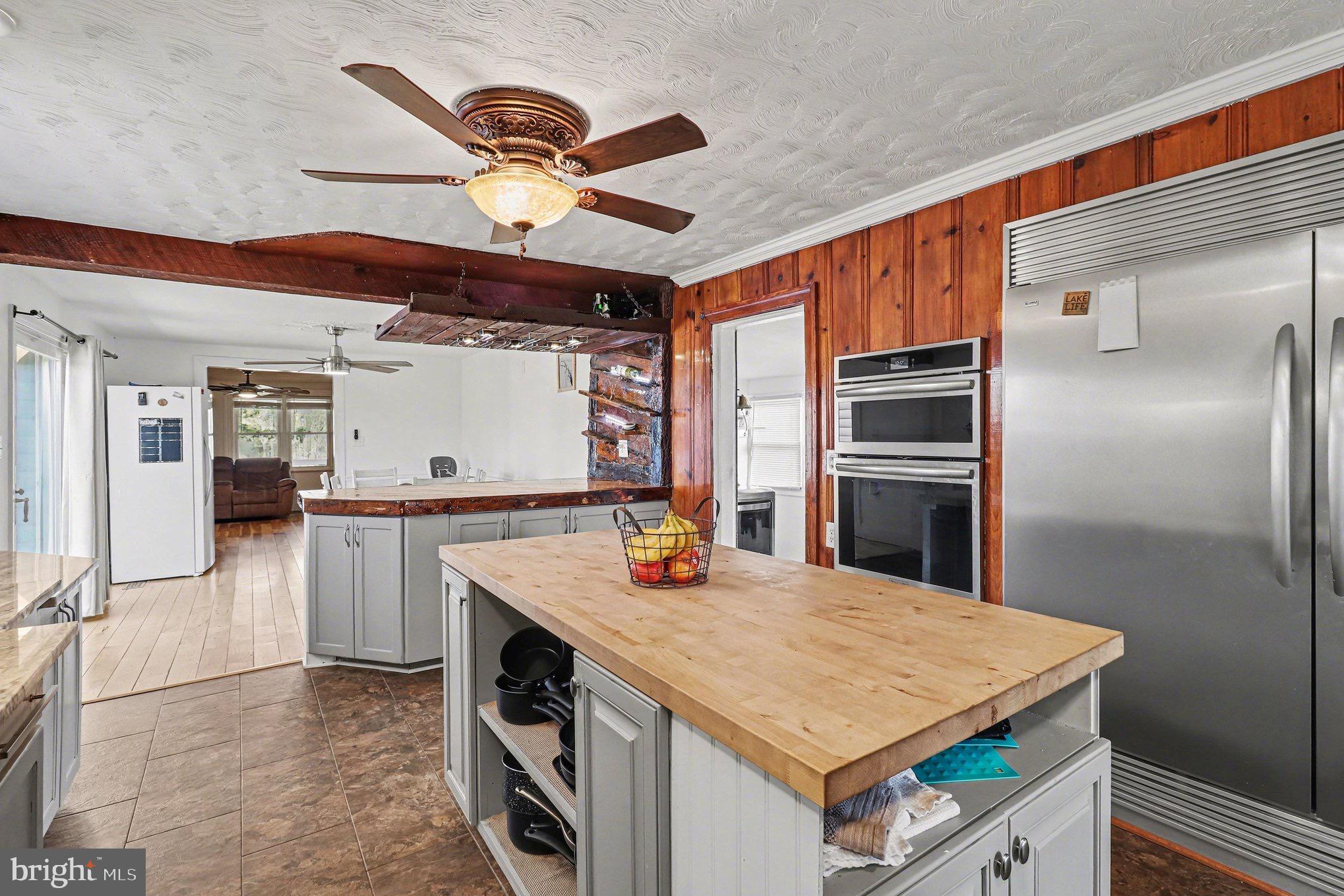 5408 Lewiston Road Spotsylvania, VA 22551 - Photo 7 of 32 a kitchen with stainless steel appliances granite countertop a refrigerator a sink and dishwasher