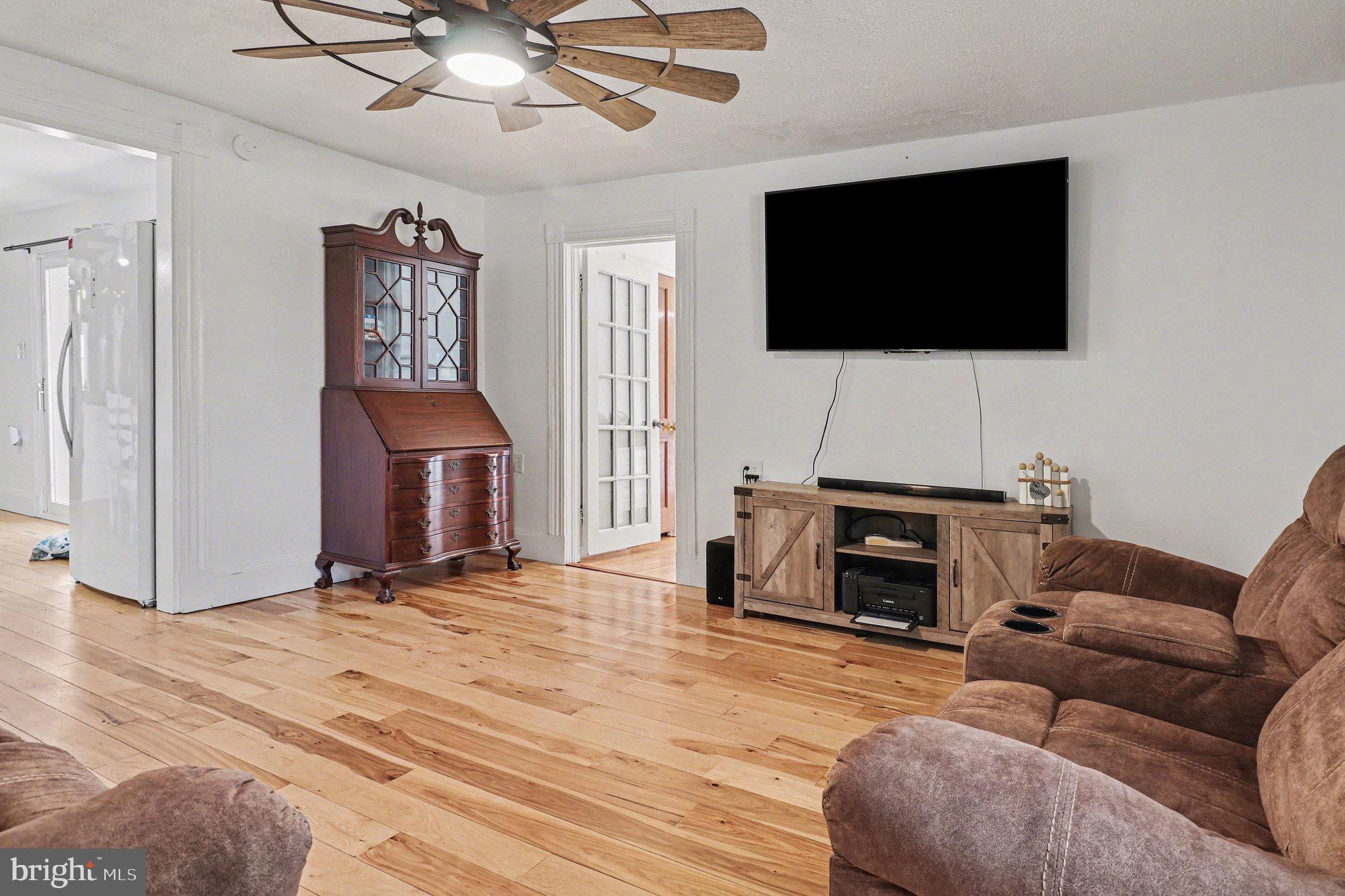 5408 Lewiston Road Spotsylvania, VA 22551 - Photo 9 of 32 a living room with furniture and a flat screen tv